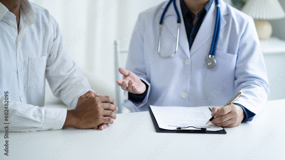 Close up view of professional physician consulting with male patient, talking to male client at medical checkup visit