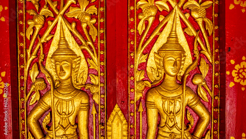 Golden fresco at Wat Hosian Voravihane Buddhist Temple in Luang Prabang Laos