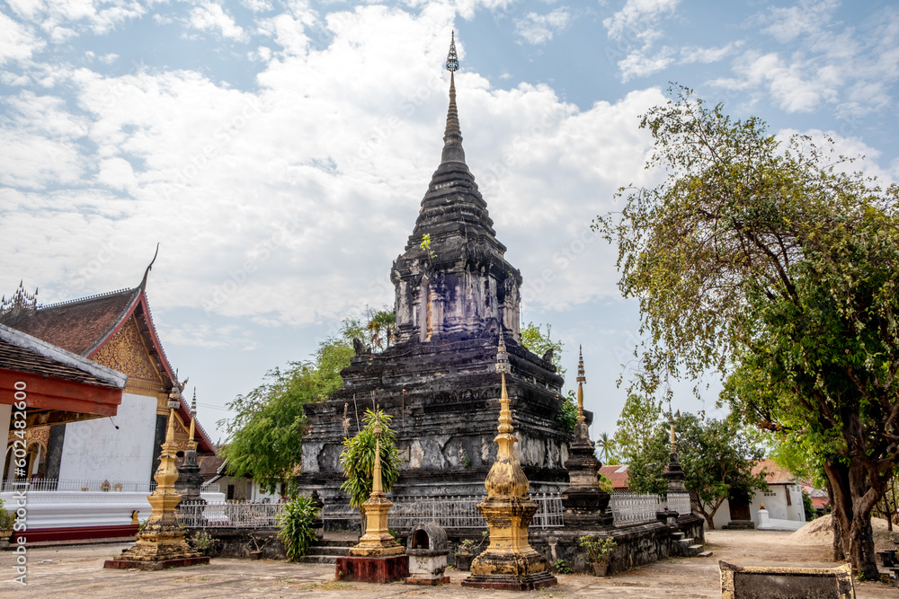 Fototapeta premium Ancient stupa at Wat Hosian Voravihane Buddhist Temple in Luang Prabang Laos