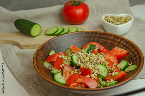 green buckwheat sprout salad, cucumbers and tomatoes