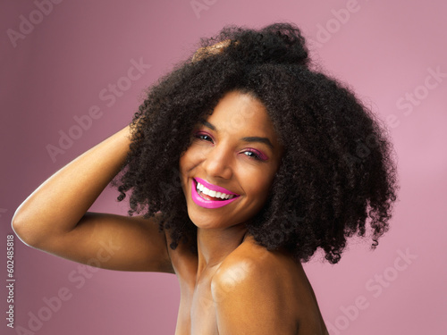 Hair care, face and smile of black woman with afro in studio isolated on pink background. Hairstyle portrait, makeup cosmetics and funny African female model with salon treatment for beauty lipstick.