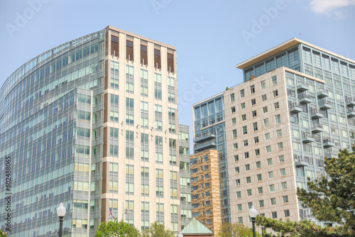 Modern building with glass windows symbolizes transparency, openness, progress, and the blending of indoor and outdoor spaces. It represents contemporary architecture and a connection 