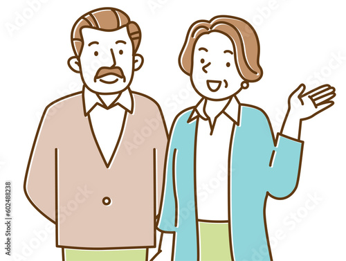 笑顔でこちらを見て手を挙げるシニア夫婦
