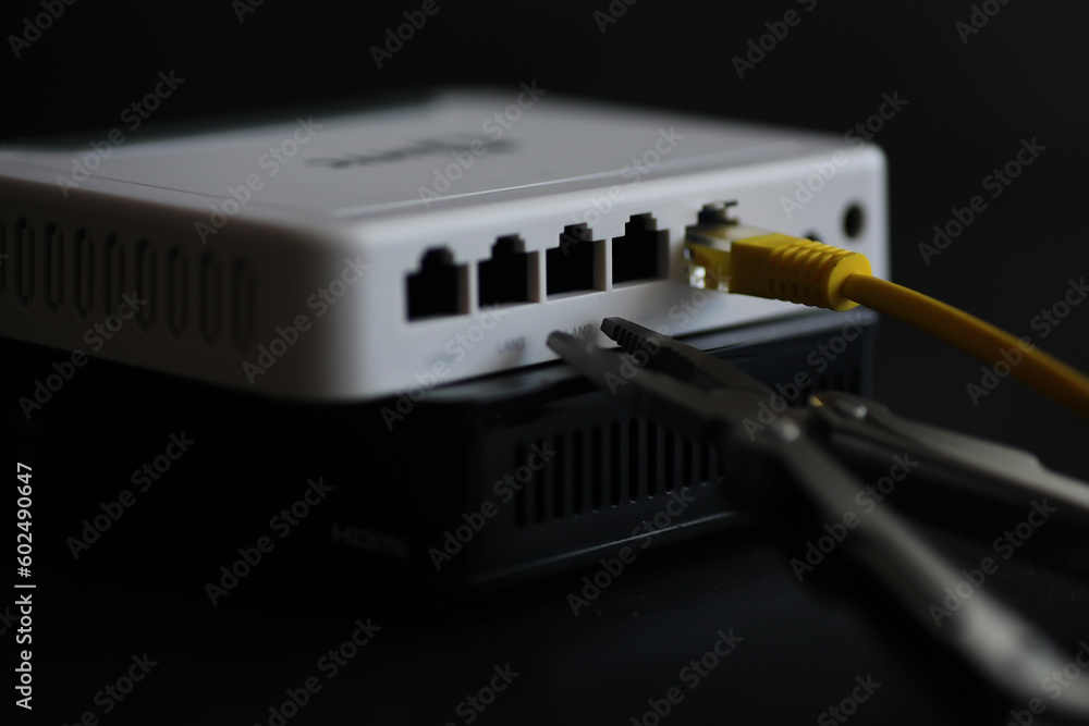 Modern dual band wireless router. Man working in the background. Fast and wireless internet concept. Modern dual band wireless router. Man working in the background. Fast and wireless internet concept.
