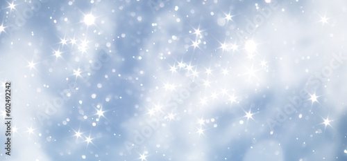 blue snowfall bokeh background, abstract snowflake background on blurred abstract blue © alexkich