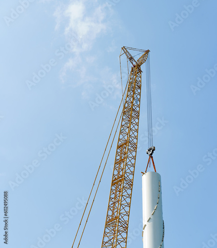 Wind turbines being hoisted and under construction
