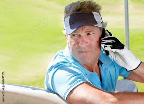 Golfer, phone and serious man outdoor on call for communication on a golf course. Senior person with smartphone while thinking about sports game at club on retirement vacation or holiday in nature