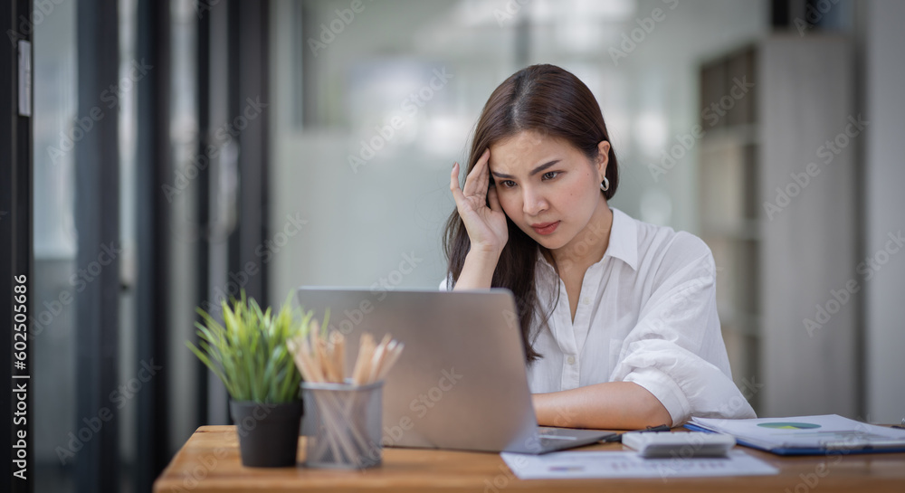 Portrait of tired young business Asian woman work with documents tax laptop computer in office. Sad, unhappy, Worried, Depression, or employee life stress concept
Portrait of tired young business Asian woman work with documents tax laptop computer in office. Sad, unhappy, Worried, Depression, or employee life stress concept