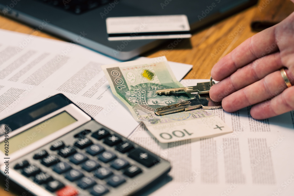 Financial documents. A banknote with a calculator in the background. Polish currency. Financial documents. A banknote with a calculator in the background. Polish currency.