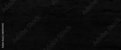 Natural black slate stone background pattern with high resolution. Top view, copy space.