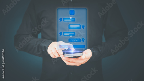 Young man using smartphone chatting with chat bot, Chat with smart AI or Artificial Intelligence technology. Futuristic technology transformation. Chatbot ai communication by mobile phone.