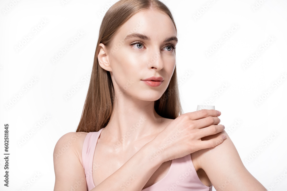 Beautiful blonde model holding cream for facial skin. Beautiful blonde model holding cream for facial skin.
