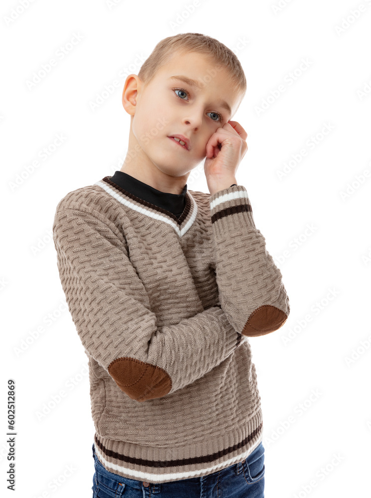 Portrait of serious schoolboy thinking and looking to the side with touching finger to the temple, isolated on white background. Thoughtful eight year old boy in brown sweater posing in studio. Portrait of serious schoolboy thinking and looking to the side with touching finger to the temple, isolated on white background. Thoughtful eight year old boy in brown sweater posing in studio.