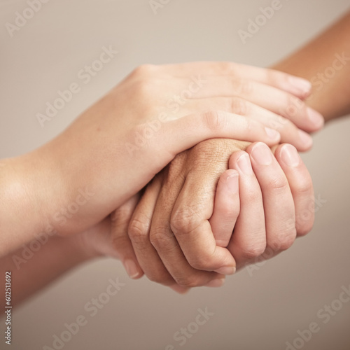 Empathy, help and love with people holding hands in comfort, care or to console each other. Trust, support or healing with friends praying together during depression, anxiety or the pain of loss © Alexandra W/peopleimages.com