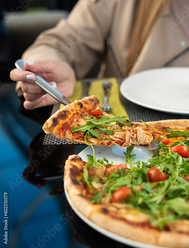 Tasty pizza with chicken and arugula