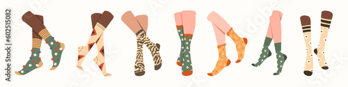 Pairs of feet in socks set. Vector illustrations of female and male underwear. Cartoon warm wool or cotton clothes for legs with funny pattern isolated on white. Accessory, footwear, fashion concept
