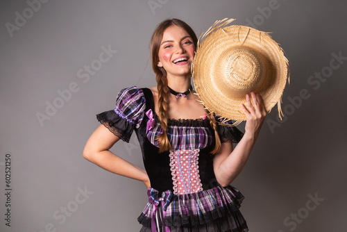 Blonde Brazilian woman, June party clothes, arraial. vertical portrait. photo