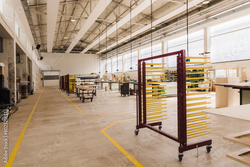 Trolley with racks in modern carpentry factory photo
