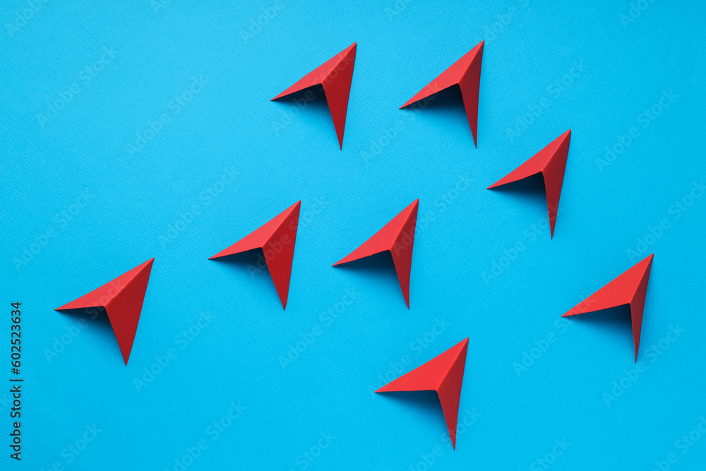 Business, startup and sponsorship concept with arrows on blue background Business, startup and sponsorship concept with arrows on blue background