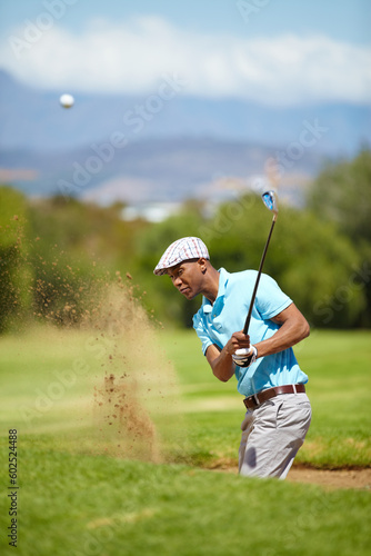 Sports, golf and black man playing in sand in game, match and competition on golfing course. Recreation, hobby and focused male athlete with club driver on grass for training, fitness and practice