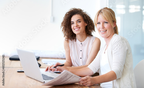 Accounting women, laptop and team with paperwork while talking in office for audit or collaboration. Female employees together with positive mindset, internet and finance documents in a meeting © Anton R/peopleimages.com