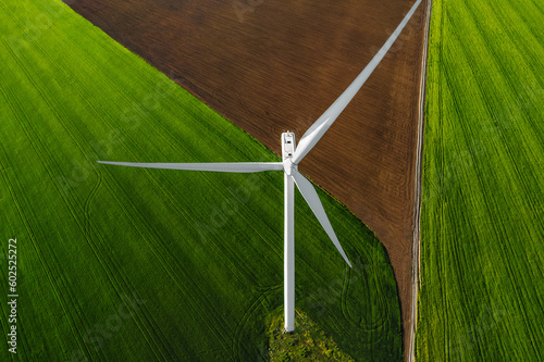 Aerial view of wind turbine on agricultural field