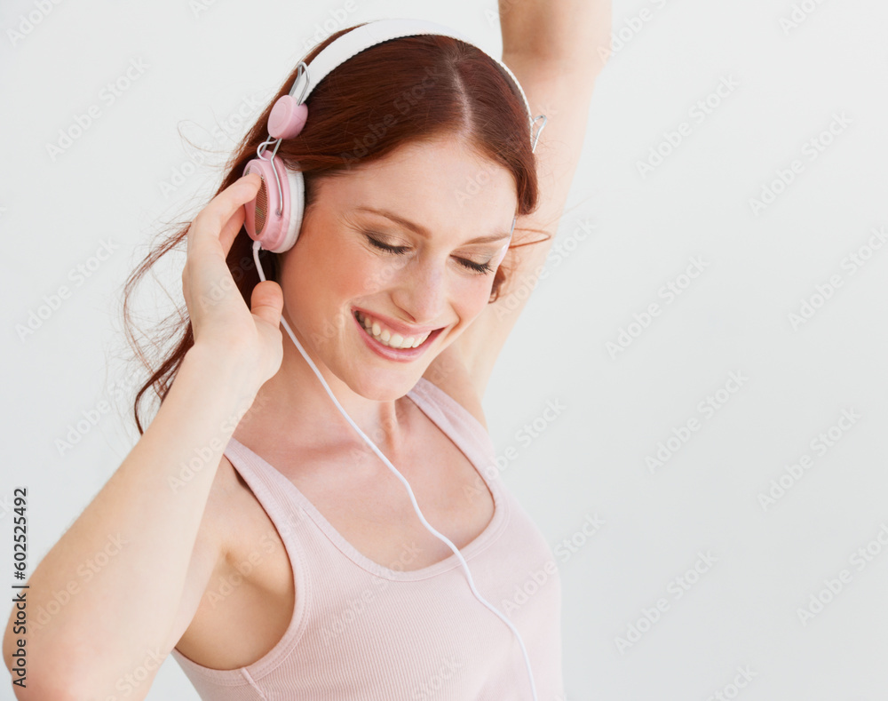 Happy woman, dance and headphones in white background, isolated studio and freedom of celebration, good mood and energy. Excited female model, dancing and listening to music, audio and radio sound Happy woman, dance and headphones in white background, isolated studio and freedom of celebration, good mood and energy. Excited female model, dancing and listening to music, audio and radio sound