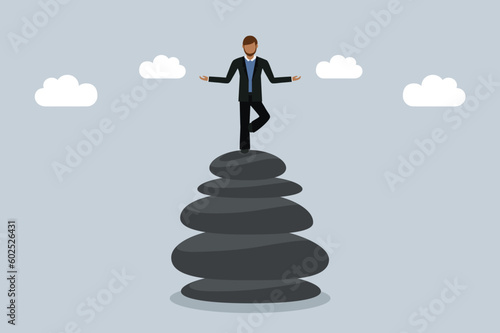 meditating business man stand on a stack of zen stones work life balance concept