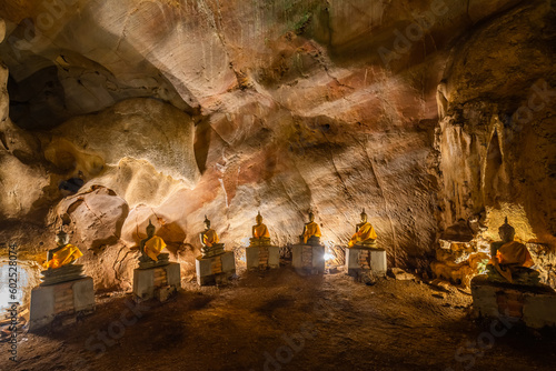 The Buddha statue is situated in the cave at Wat Khao Tham Ma Rong, Bang Saphan, Prachuap Khiri Khan, Thailand