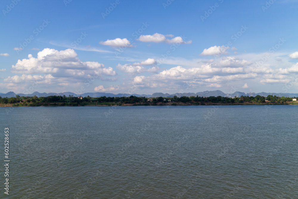 Coastal view of Laos as seen from the coast of Nakhon Phanom Province, Thailand. will see the vast Mekong River and beautiful sky