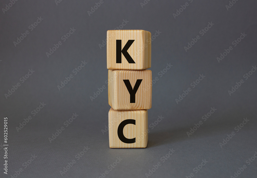 KYC - Know Your Customer. Wooden cubes with word KYC. Beautiful grey background. Business and Know Your Customer concept. Copy space. KYC - Know Your Customer. Wooden cubes with word KYC. Beautiful grey background. Business and Know Your Customer concept. Copy space.