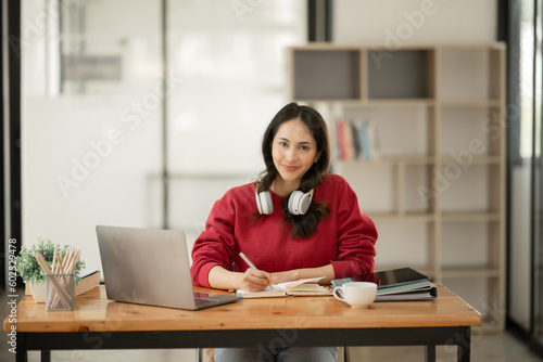 Asian businesswoman sitting and working about documents at the office