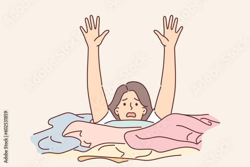 Woman housewife is drowning in dirty laundry and screaming raising hands for concept household