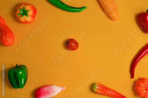 Fototapeta Naklejka Na Ścianę i Meble -  Colorful vegetables on orange background, Healthy food background, vegetarian food concept