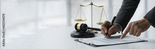 copy space, banner, panorama Lawyer or legal advisor reading and reviewing contract documents for fairness and legality before signing in office legal concept.
