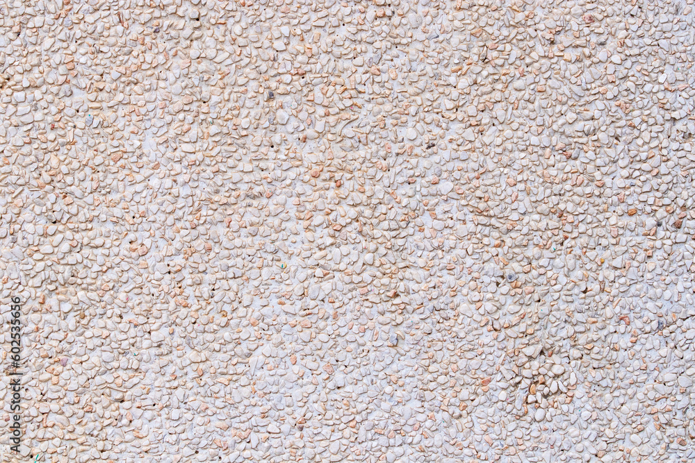 Background or texture Abstract Natural pattern of pebbles small or gravel color yellow, orange attached with beautiful cement concrete. used to make wallpaper website along walls of houses, building Background or texture Abstract Natural pattern of pebbles small or gravel color yellow, orange attached with beautiful cement concrete. used to make wallpaper website along walls of houses, building
