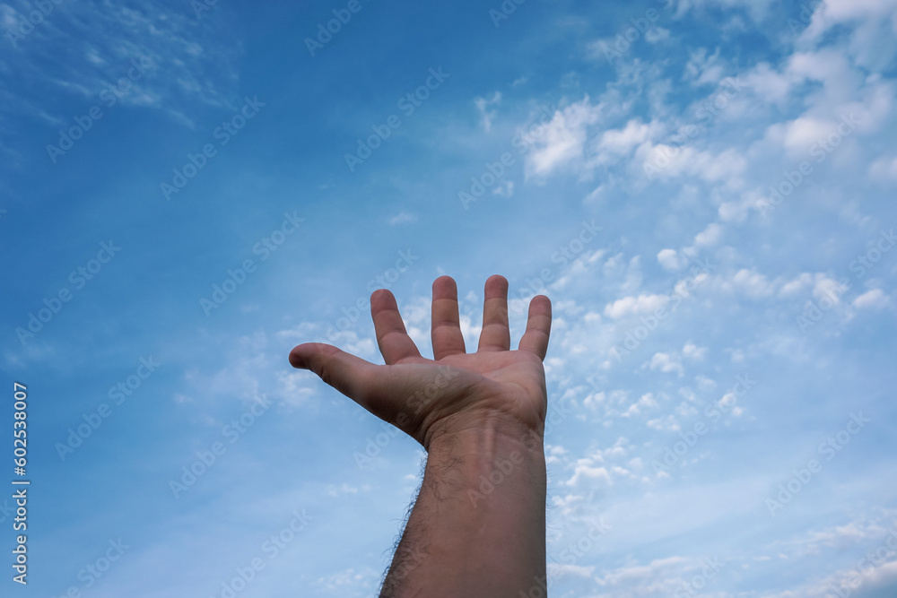 hand up gesturing in the blue sky, feelings and emotions hand up gesturing in the blue sky, feelings and emotions