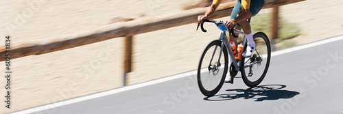 Road bike cyclist man cycling, athlete on a race cycle. Panning technique used
