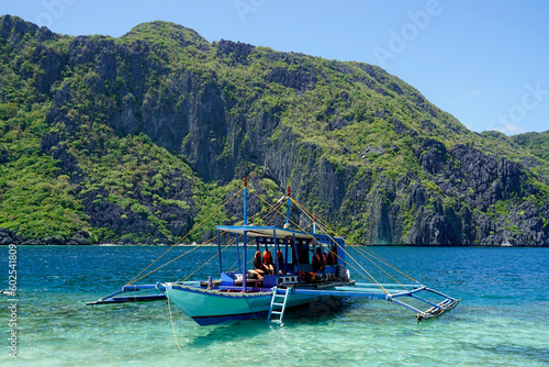 Canvastavla traditional wooden outrigger boats on palawan island