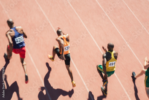 Runners racing on track photo