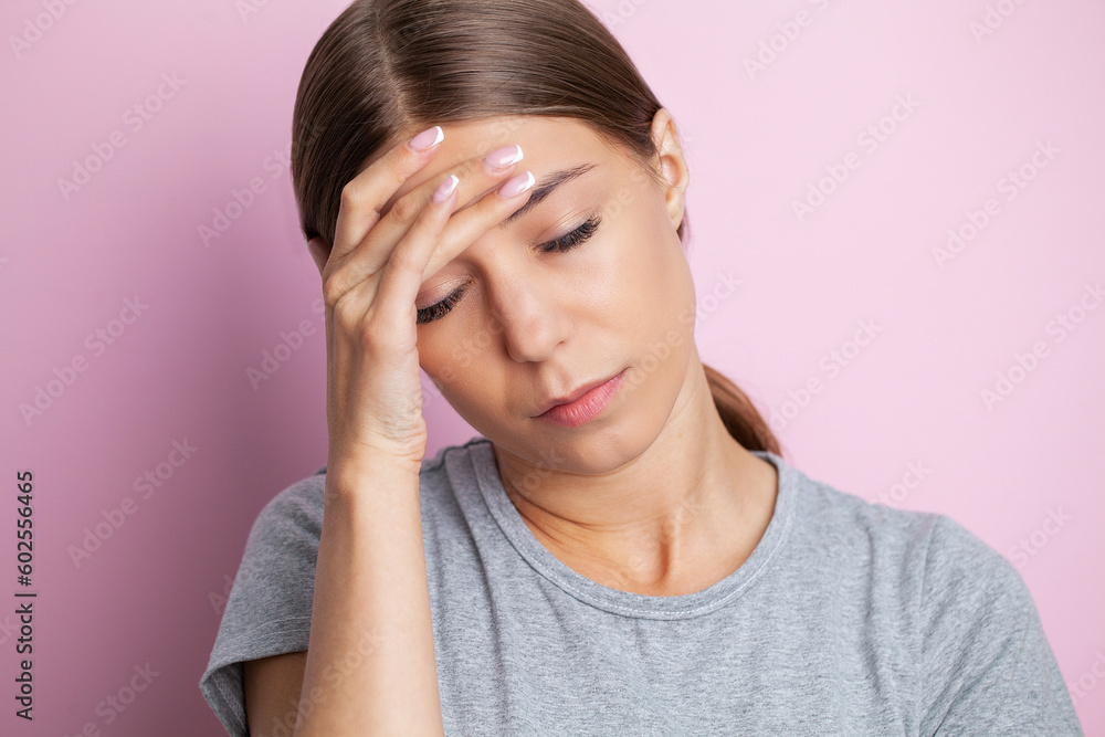 Feeling strong headache massaging temples exhausted from overwork, fatigued overwhelmed lady. Feeling strong headache massaging temples exhausted from overwork, fatigued overwhelmed lady.