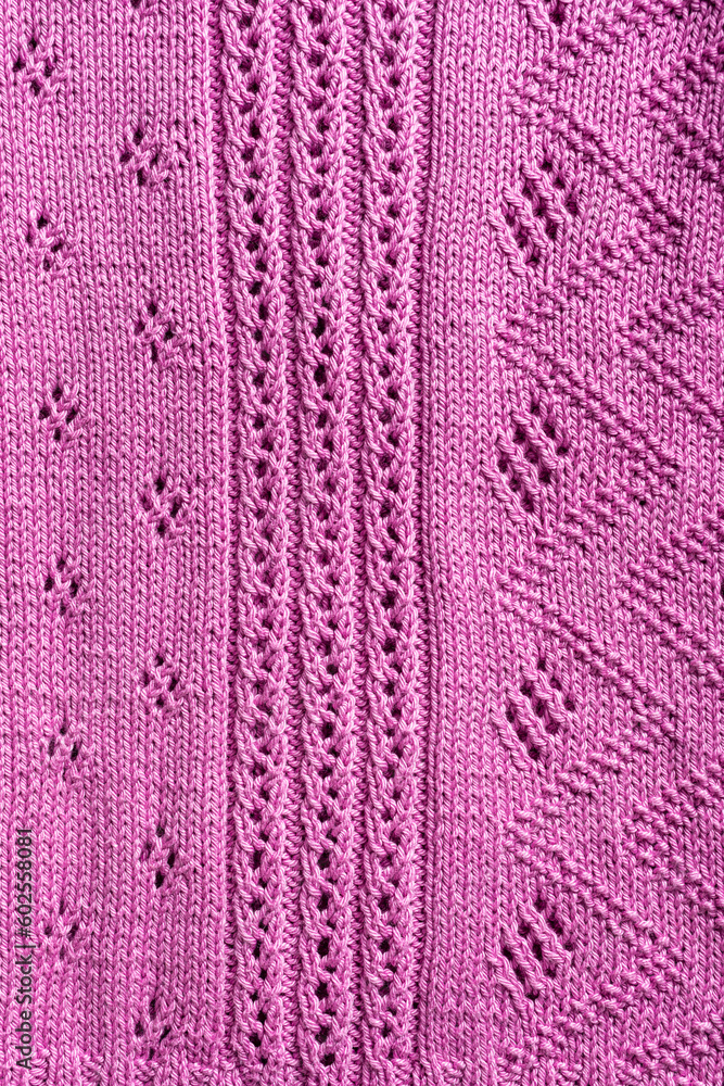Handmade pink fuchsia lase knitting cotton texture background with knitted simple pattern. Top view of knitting clothes