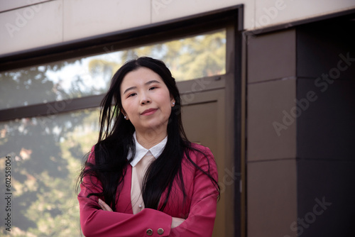 Young Chinese woman dressed as a businesswoman