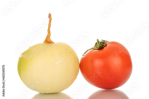 One peeled onion and one tomato, macro, isolated on white background.