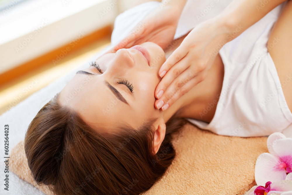 Close-up of young woman getting spa massage treatment at beauty spa salon. Close-up of young woman getting spa massage treatment at beauty spa salon.