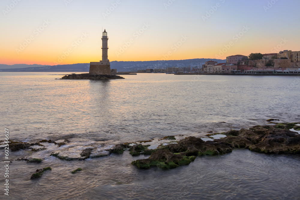 Lighthouse at the old Venetian Harbour at sunrise, Crete Island, Greece