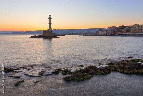 Lighthouse at the old Venetian Harbour at sunrise, Crete Island, Greece