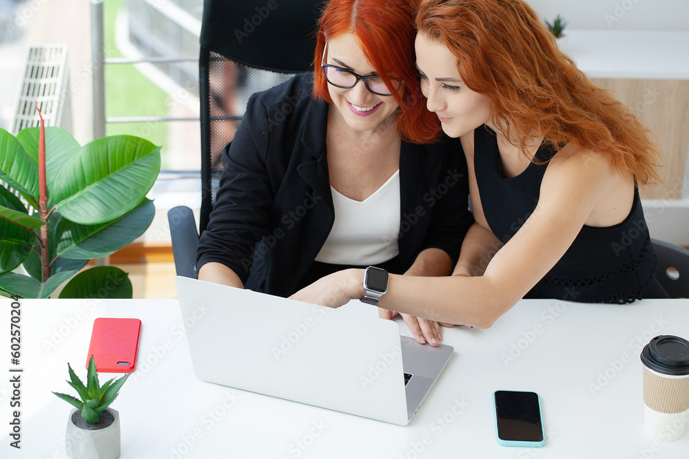 Smiling business woman working together on contract documents. Smiling business woman working together on contract documents.