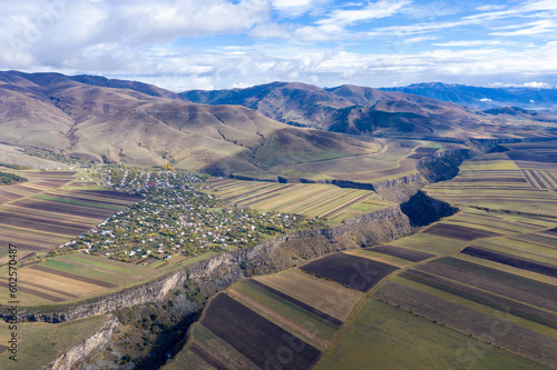 Drone view of Dzoraget river canyon and Agarak village on sunny autumn day. Lori Province, Armenia. photo