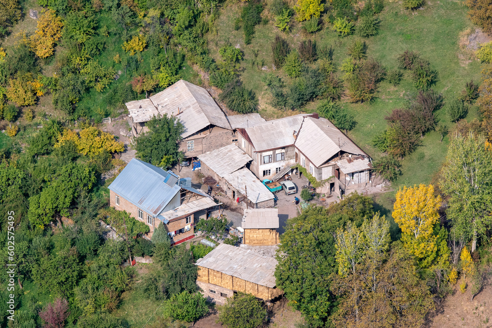 View of traditional rural houses on sunny autumn day. Artabuynk village, Vayots Dzor Province, Armenia.